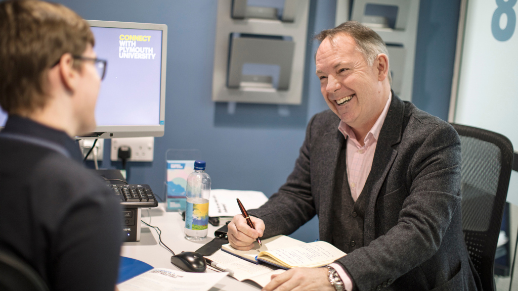 Student talking to mentor