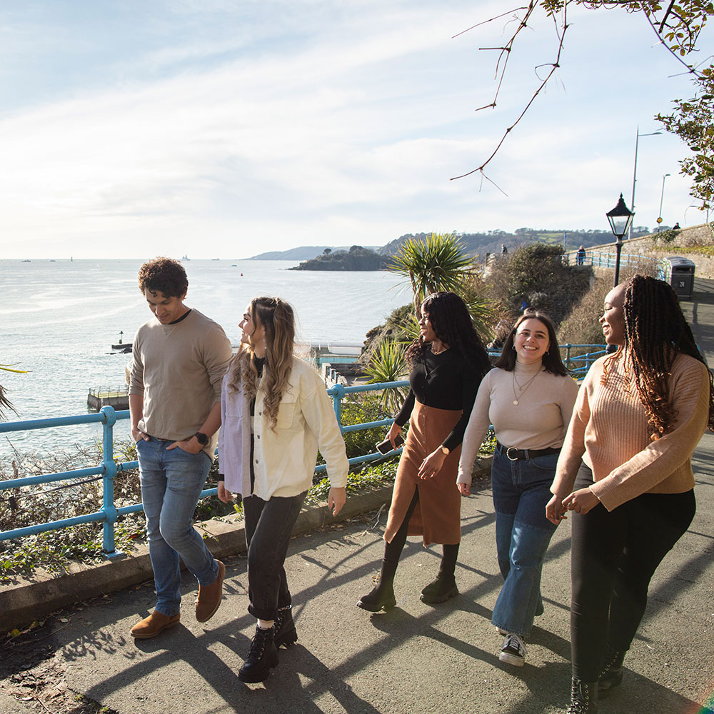 Students walking along the Hoe