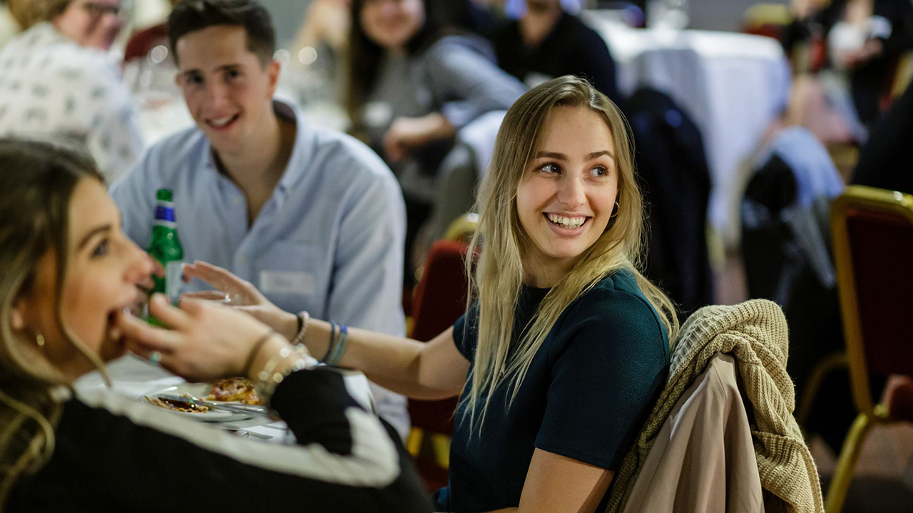 Smiling student at alumni event