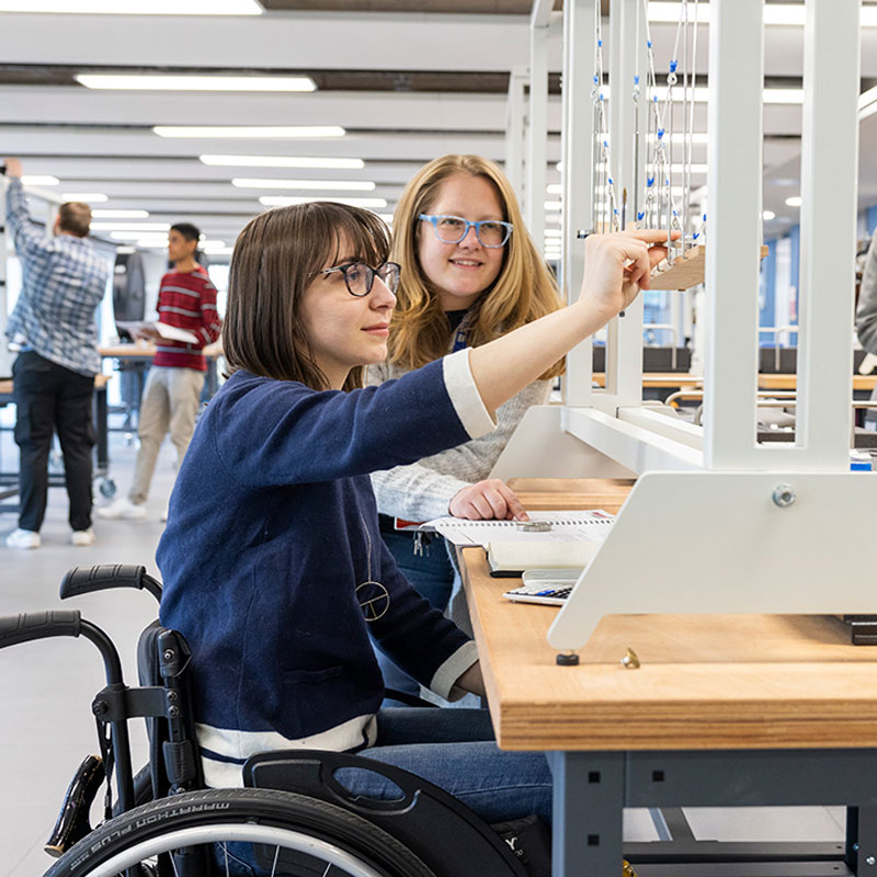 Students using equipment in the STEAM lab
